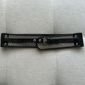 Women’s Belt Size Medium/Large. Black with Woven Design on Front.
